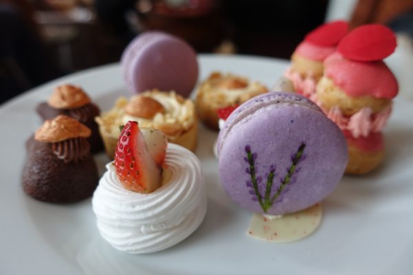 rose cream puffs, lavender macarons, strawberry meringue and chocolate delights