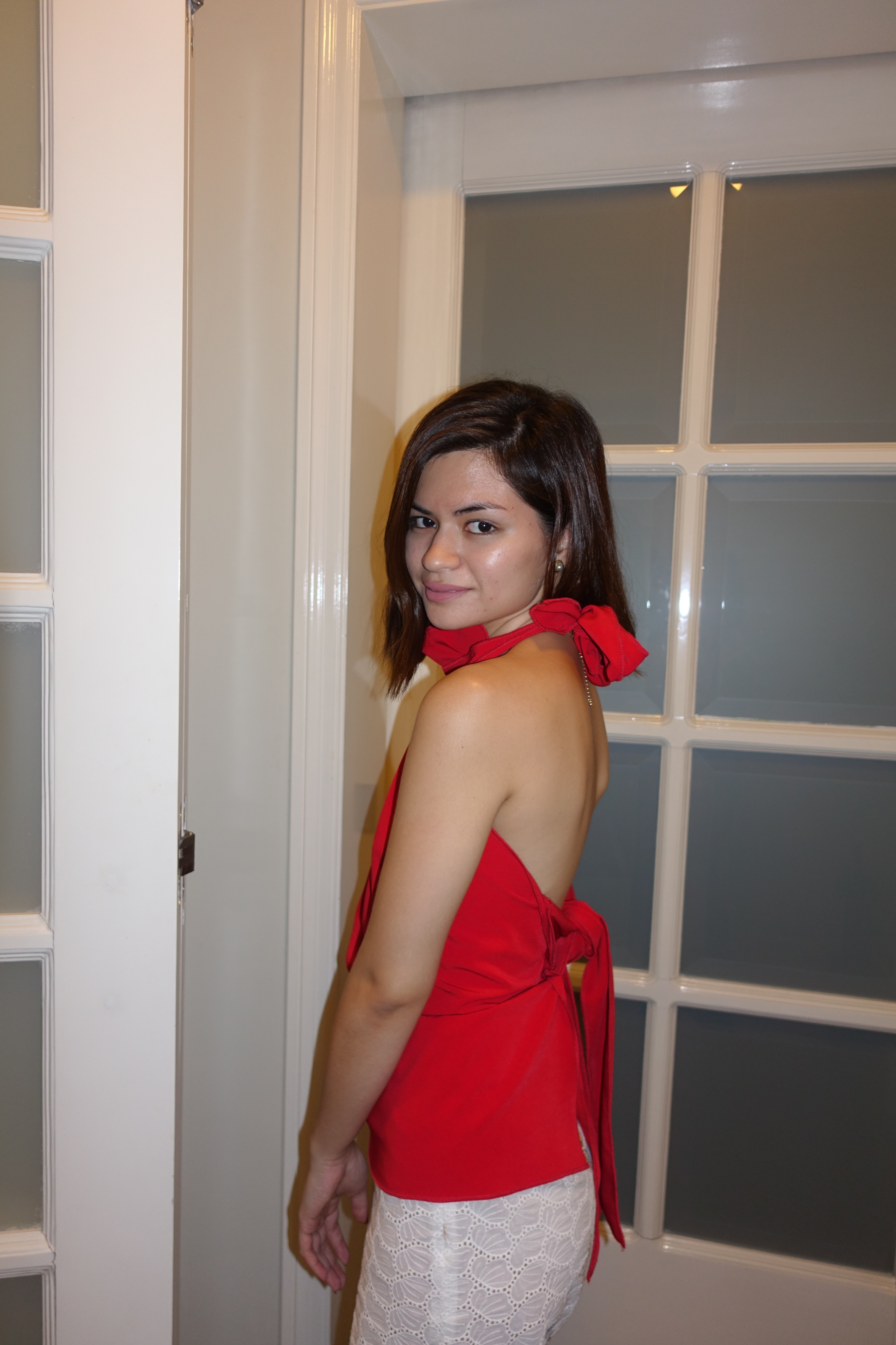 cecilia in this red backless piece